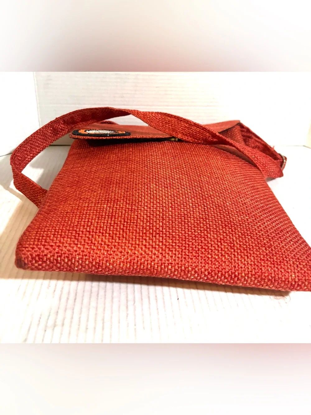 Handwoven Orange Crossbody Bag with Beaded Accent